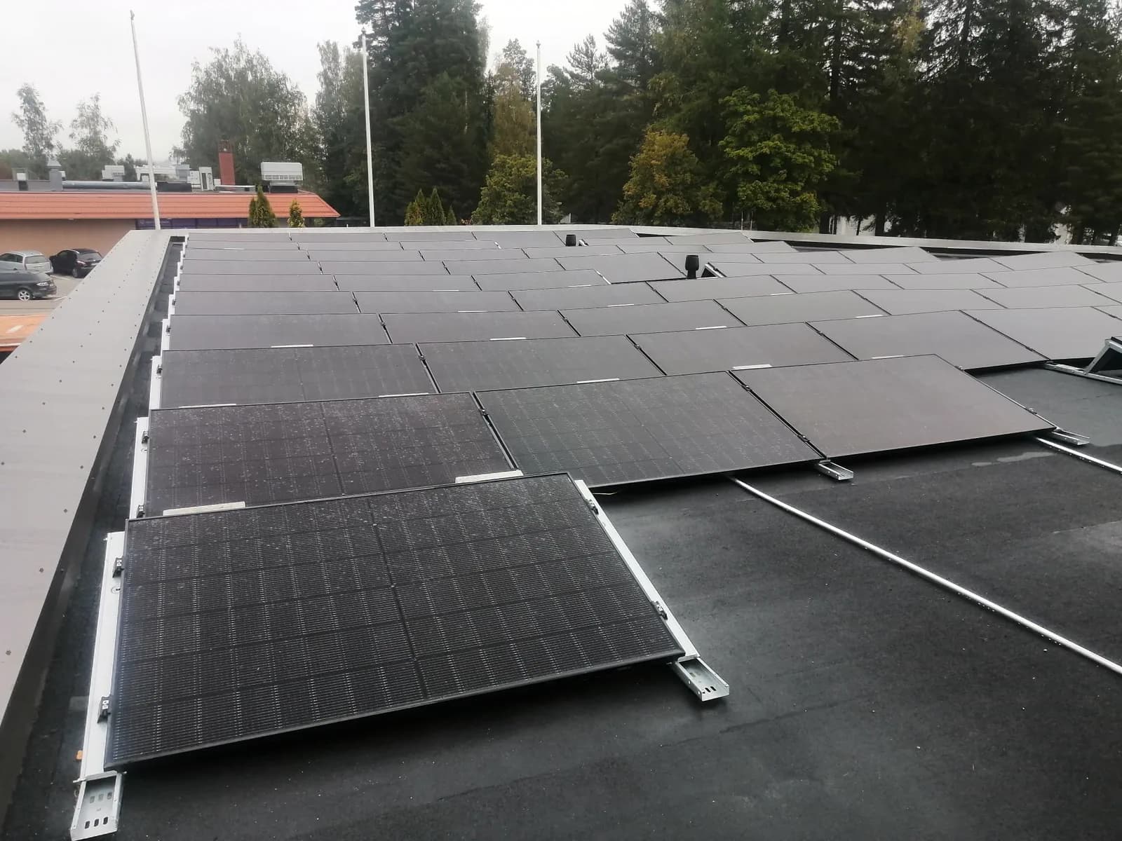 Large solar power system on the flat roof of a commercial property